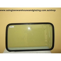 FORD TRANSIT VE/VF/VG - 4/1994 - 9/2000 - VAN - SWB - DRIVERS - RIGHT SIDE REAR CARGO GLASS WITH FIXED RUBBER IN WINDOW - S RUBBER - NEW (970W * 570H)