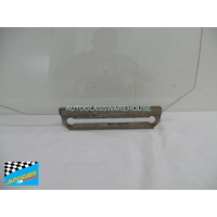 MAZDA 323 - 3/1977 TO 9/1985 - 4DR WAGON - PASSENGERS - LEFT SIDE REAR DOOR GLASS - GREEN - (SECOND-HAND)