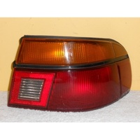 FORD LASER KF/KH - 5DR HATCH 3/90>10/94 - DRIVERS - RIGHT SIDE TAIL LIGHT (genuine)