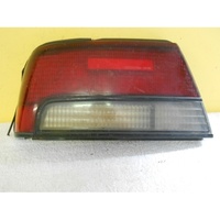NISSAN MAXIMA J30 - 5/1990 to 1/1995 - 4DR SEDAN - LEFT SIDE TAIL LIGHT (GENUINE)