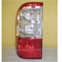 NISSAN PATROL GU 1/2 - 10/2001 TO 9/2004 - 4DR WAGON - LEFT SIDE TAIL LIGHT - CLEAR/RED