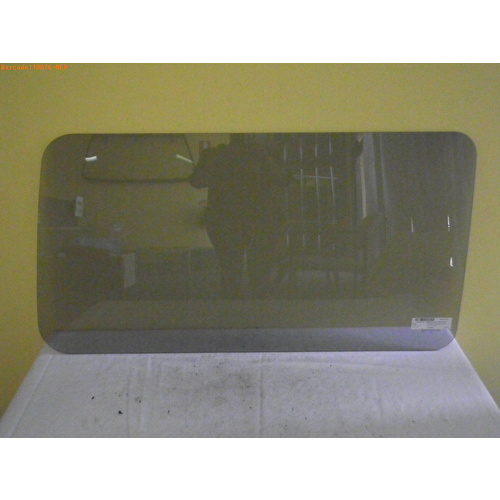 FORD ECONOVAN JG/JH - 5/1984 TO 12/2005 - SWB VAN - DRIVERS - RIGHT SIDE REAR FIXED GLASS - RUBBER IN - 495MM X 950MM - NEW