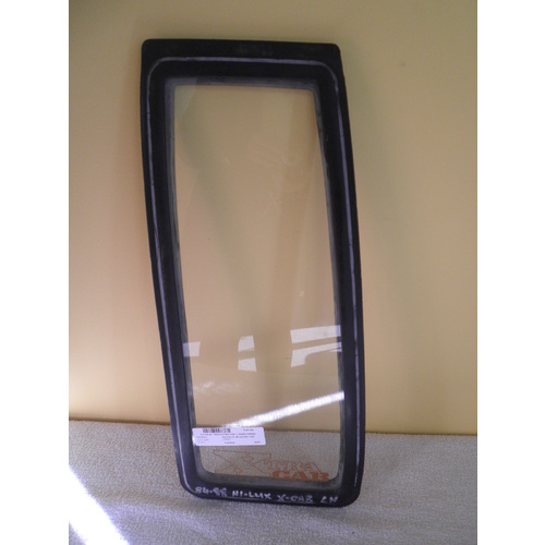 suitable for TOYOTA HILUX RN55 - 8/1983 to 7/1988 - 2DR XTRA CAB - LEFT SIDE FIXED REAR OPERA GLASS - (Second-hand)